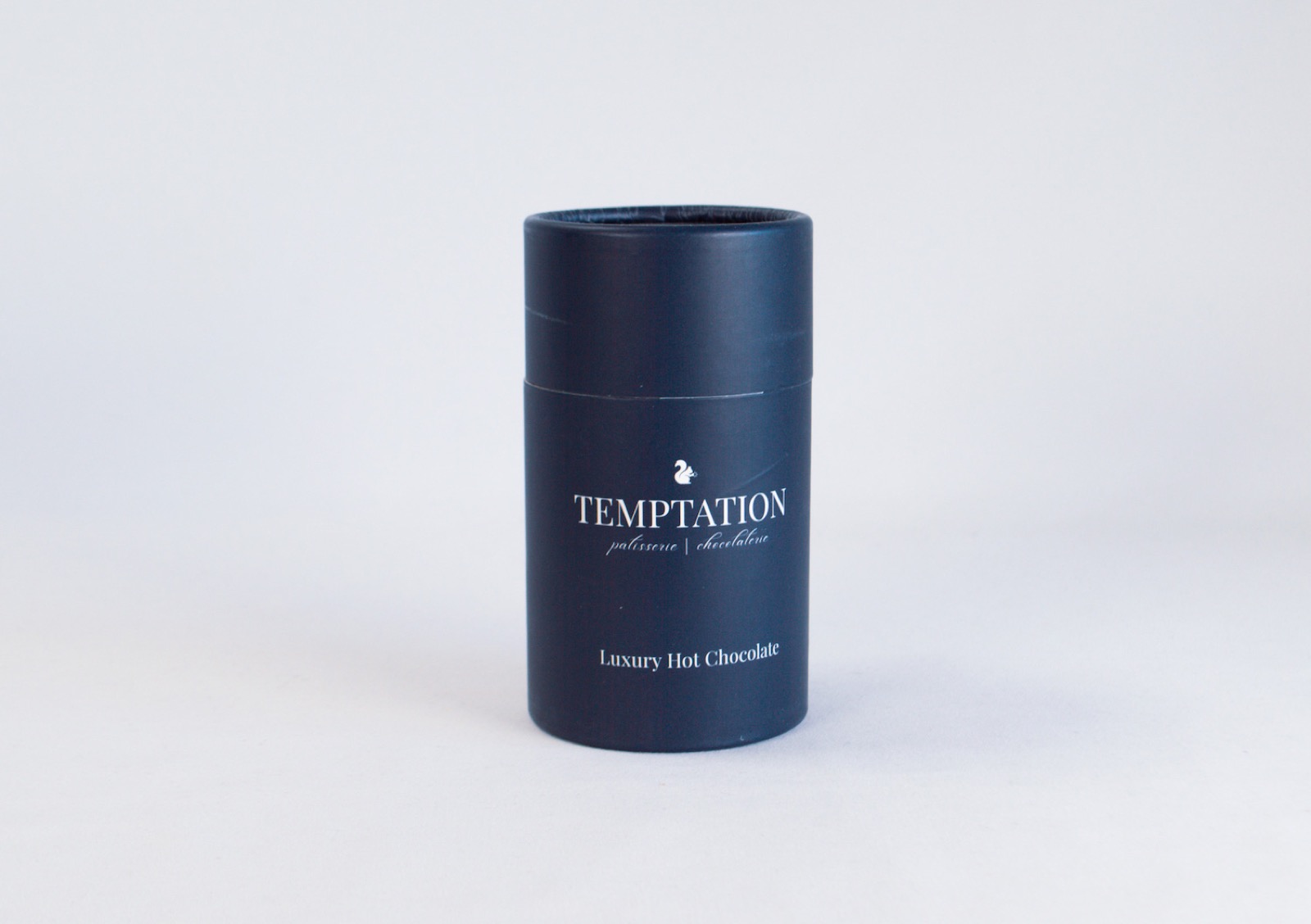 Printed hot chocolate tube with a short lift-off lid at the top