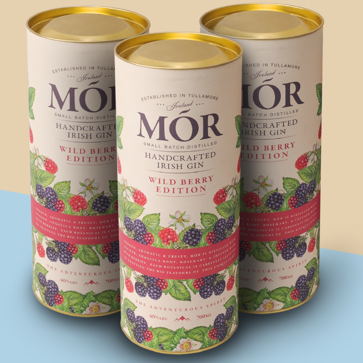 Detailed view of Mór gin cardboard tubes with gold metal lids